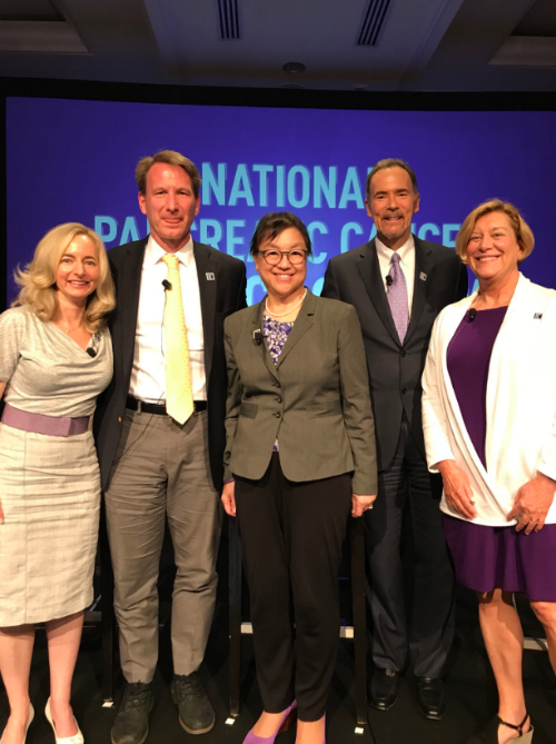Four experts stand with PanCAN president and CEO for the scientific panel on pancreatic cancer.