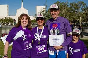 Dr. Nicholas Nissen (top fundraiser) with his son, Gabriel, and, from left, Judy Fischer (third top fundraiser) and Alma Gomez (second top fundraiser) at PurpleStride Los Angeles.  Dr. Nissen’s team, the Cedars-Sinai Whipplers, raised more than $38,000 for PurpleStride Los Angeles. The Whipplers were the top fundraising team on event day, and Dr. Nissen was the top individual fundraiser.