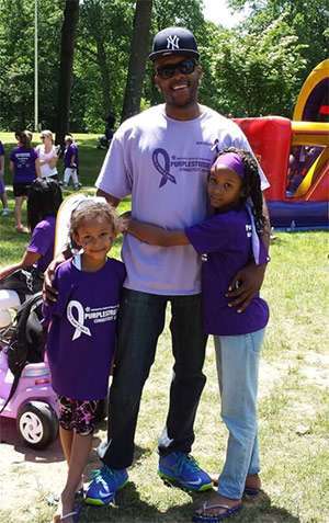 Terry spending time with his daughters at PurpleStride Connecticut 2014.