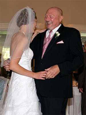 Bryant dancing with her father on her wedding day.