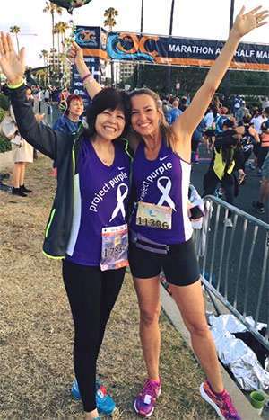 Lupe (left) and friend Julie Weiss feeling victorious after completing a race.