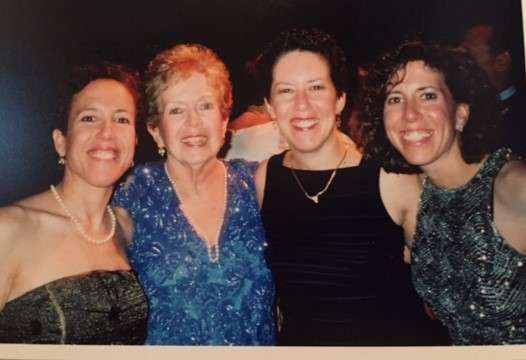 Randi’s favorite picture with her mom and two sisters at a wedding. Her mom passed away of pancreatic cancer in 2006.