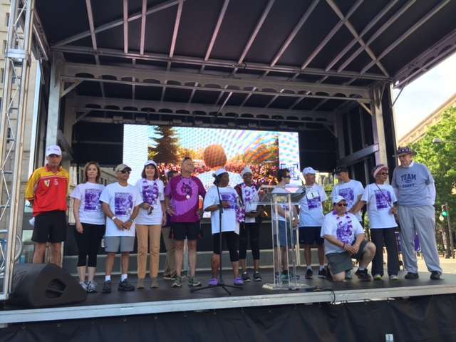 Pancreatic cancer survivors are cheered onstage at walk event hosted by Pancreatic Cancer Action Network