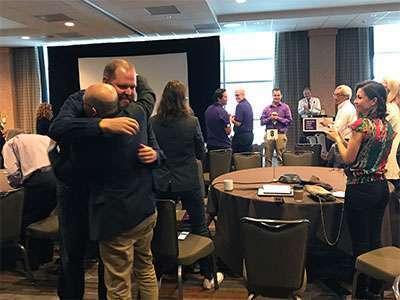 Pancreatic cancer survivor’s speech is met with a standing ovation and hugs from researchers