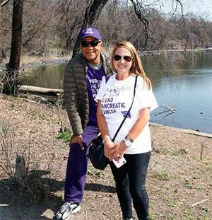 Ron and Camille smiling during a break at PurpleStride New York City in Prospect Park,