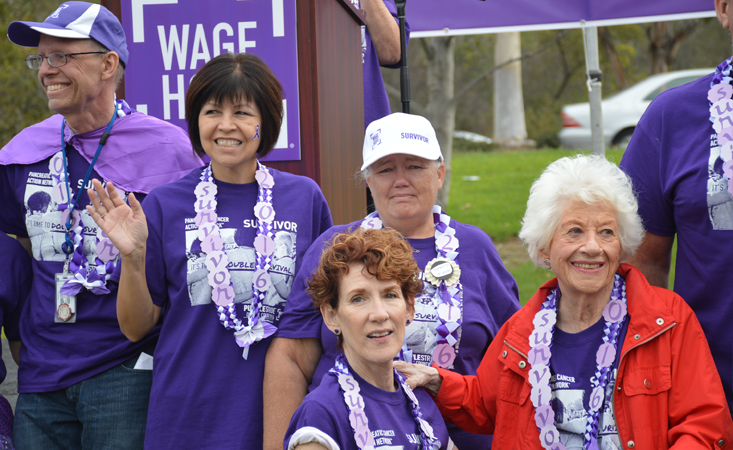 Influencer of Hope Charlotte Rae stands with fellow survivors at walk to end pancreatic cancer