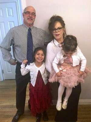 Husband, father and pancreatic cancer survivor with his wife and two daughters