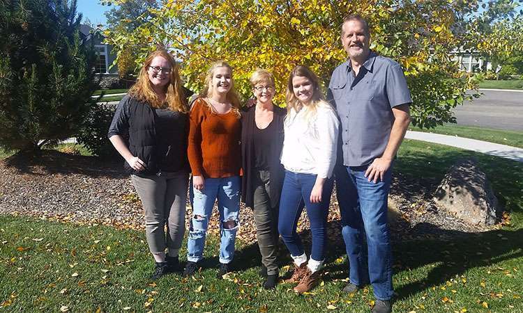 Pancreatic cancer survivor with her husband and three adult daughters on a fall day in Idaho