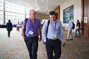 Andrew Aguirre, MD, PhD, and another researcher at the PanCAN annual summit for scientists