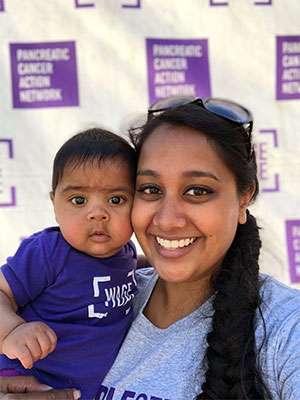 Volunteer with her baby at PurpleStride walk in San Francisco to end pancreatic cancer