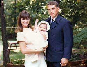 John and Marlene Vedock hold their infant daughter.