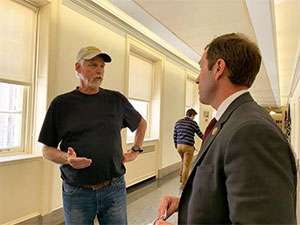 Husband of pancreatic cancer patient talks with Congressman Jason Crow in Washington, D.C.