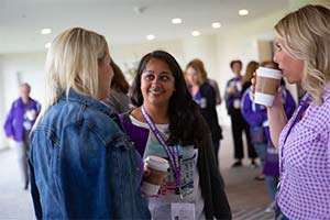PanCAN San Francisco Affiliate volunteer speaks with other volunteers at 2019 leadership training