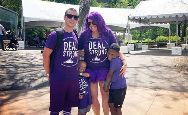 Feature image Young pancreatic cancer survivor participates in fundraising walk with his wife and two sons