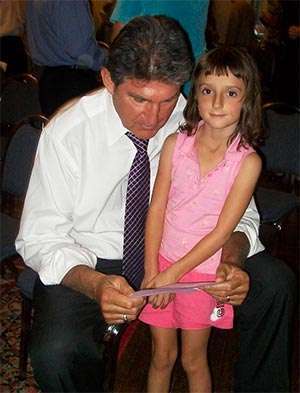 West Virginia Senator Joe Manchin with pancreatic cancer advocate Stephanie Santilli as a child