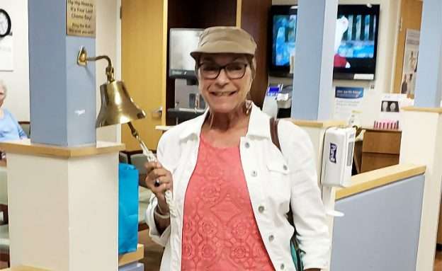 Feature image Stage 4 pancreatic cancer survivor rings bell after last chemotherapy treatment