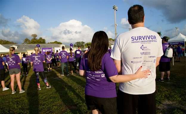 Feature image Pancreatic cancer survivor with participant at PanCAN’s PurpleStride walk/run event