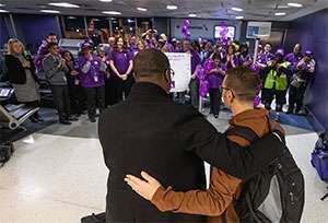 American Airlines employees gather to support pancreatic cancer survivor at LaGuardia Airport 