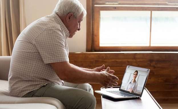 Feature image Pancreatic cancer patient speaks to his doctor about COVID-19 via video chat