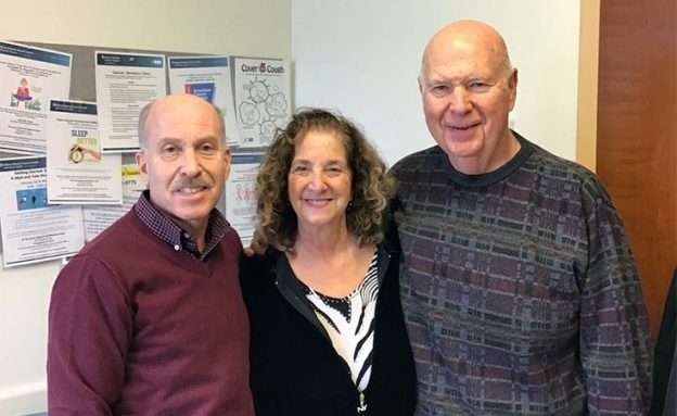 Feature image Two pancreatic cancer survivors and a caregiver in healthcare specialist’s office