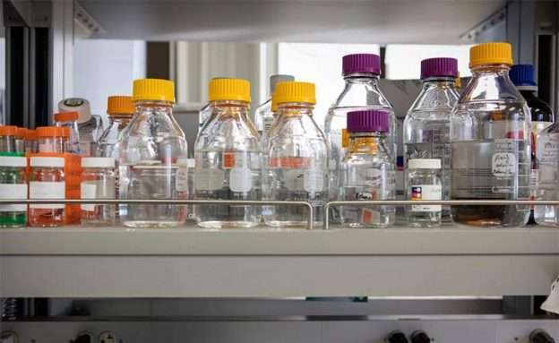 Feature image Bottles in a pancreatic cancer lab that are used to study autophagy, self-eating cells
