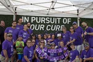 Team posing for photo at PurpleStride Miami 2019