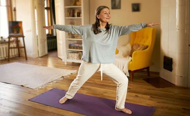 Feature image middle-aged woman doing yoga