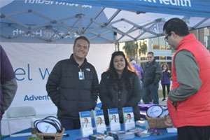 AdventHealth employees working their booth at PurpleStride Central Florida