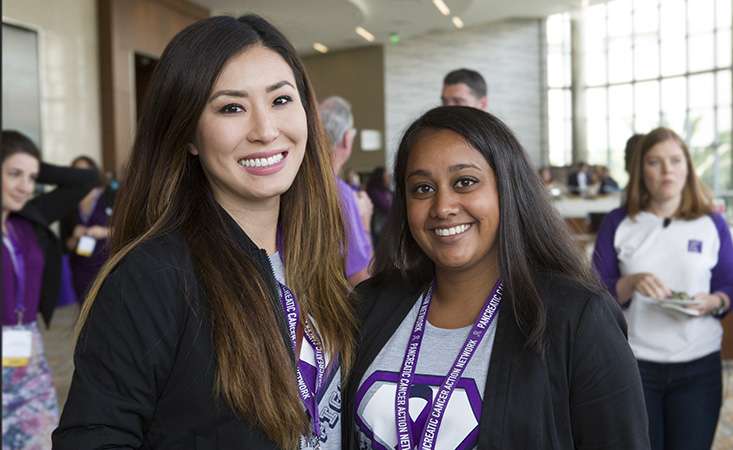 Two women wearing purple in support of PanCAN.