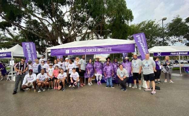 Feature image Memorial Cancer Institute PurpleStride team pictured in front of their Sponsor tent.