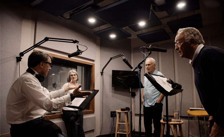 Feature image Podcast host and guests in a studio recording an episode for the "First Line of Defense" podcast series.