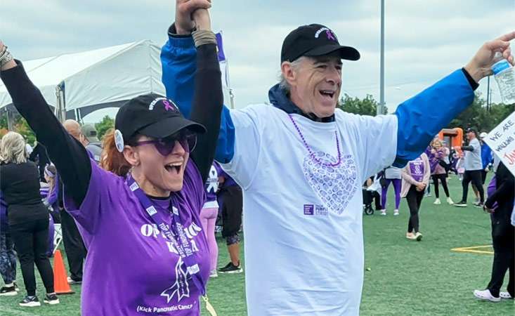 Feature image Camille and JR cross the finish line at PanCAN PurpleStride Houston